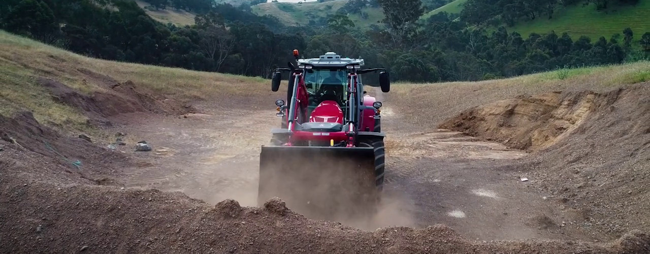 Tractor digging ground